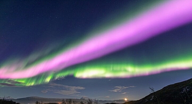 Magnificent Solar Storm Unveils Rare Pink Aurora and Mysterious Blue Glow