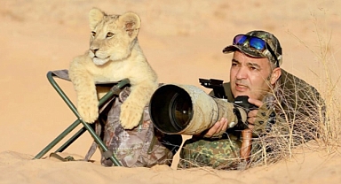 Wildlife Photographer's Heartwarming Bond with Lion Cub Captivates the Internet