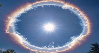 Radiant Aries Supermoon and Ice Halo Illuminate Alaska’s Night Sky